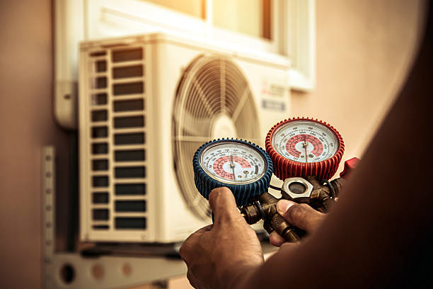 Professional Heat Pump Repair technician working in Plympton, MA